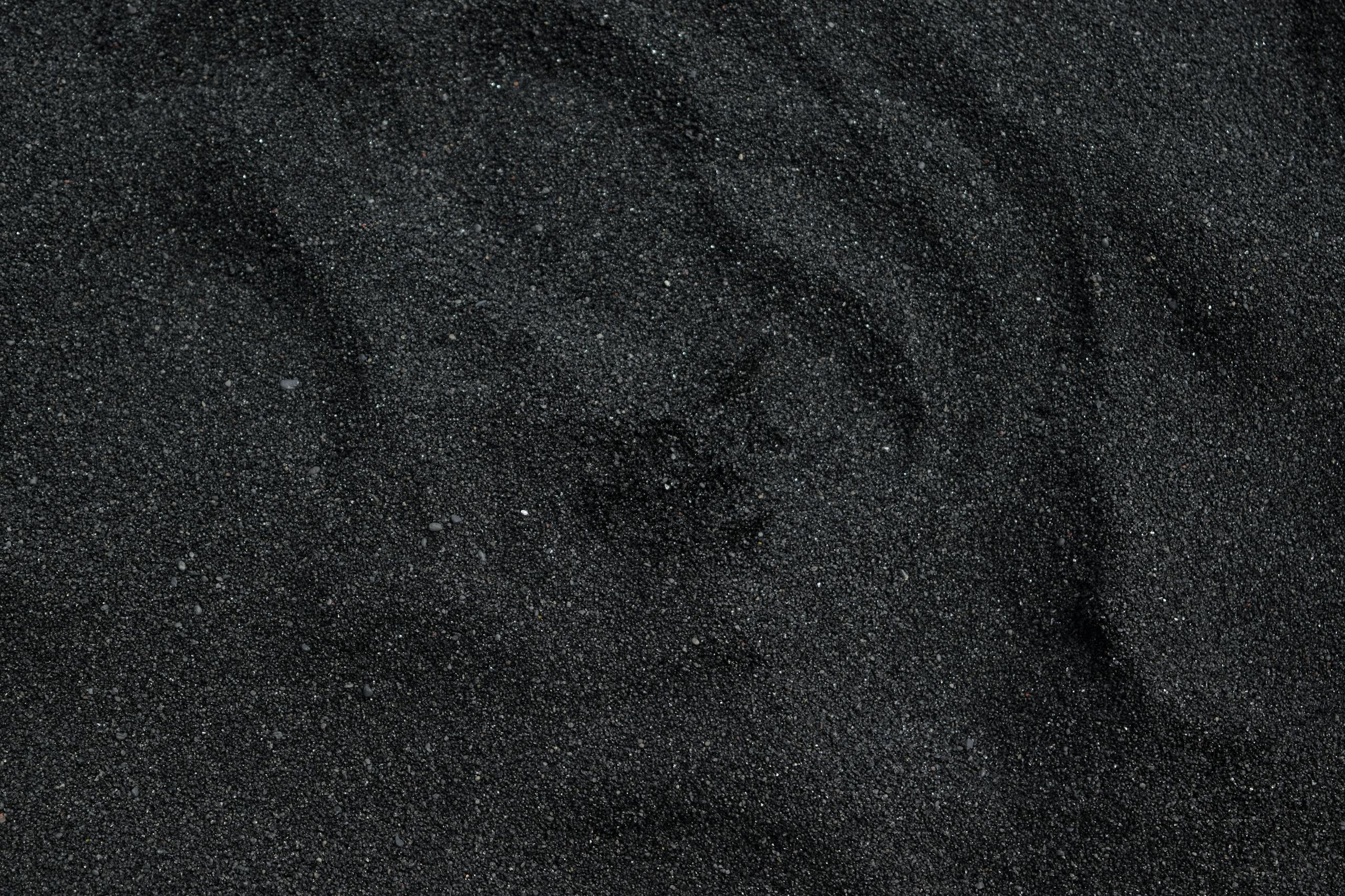 Photo by Daniel Absi Close-up of black sand texture from Waimea Beach in Hawaii. Ideal for backgrounds.